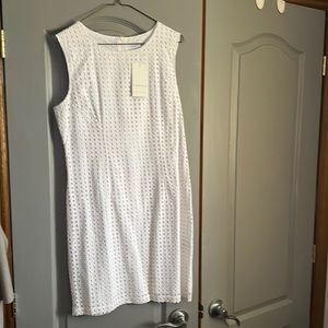 Sleeveless white dress with small square pattern throughout